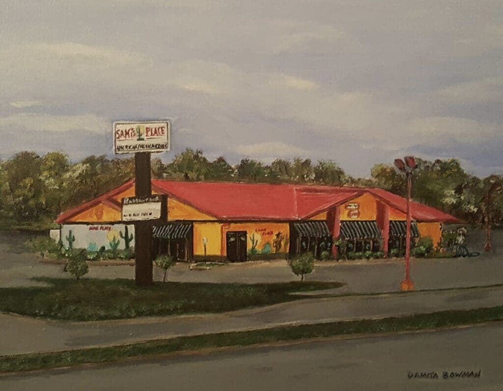 A restaurant on the side of an empty road.